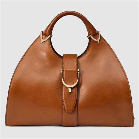 gucci stirrup top handle bag